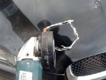 I made a template by tracing round the "retaining catch assembly" on the replacement bonnet then carefully hacked out the appropriate section of the upper skin.