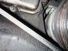 Oil seeping past upper-right bolt.