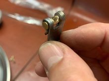 Bent the steel strap over brass rod for shape. 
 Then cut the slot.Brass rod cut to length, drilled and tapped.  