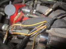 This photo shows the 5v solid yellow feed joined to two bullet connectors. These connectots fit into the electrical switch's bullet connectors seen in the background. You can just see the male bullet connector's yellow wire looping round and into the sleeved llom. This goes to the ATS plug.