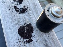 Don't breathe in the dust!  Knocking the crud out of the motor cover

