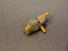 When Cold this Valve is open allowing Vacuum to pass through and closes when it reaches a certain Temperature