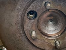 Hole gives access to bolts.