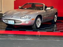 My 2002 Platinum XKR. She’s juuuust about to turn 30k on her next outing. 
I’m the second owner having purchased in 2022. I’ve done some mechanical freshening, all fluids, sway bar bushings, a/c repair, convertible hydraulic lines, new electronic struts, tires, brake pads and a few more I’m sure. 

Scored a 998.4 in the New England JCNA Concourse show last year and we took third place (XK8/XKR class) in the nation in the JCNA slalom event last fall. 