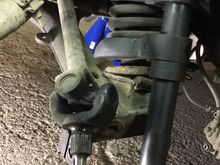Spring compressor.. not expensive and a very useful tool..