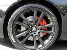 Satin black wheels red calipers