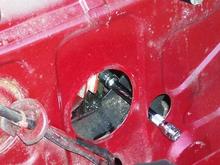I used a 6". 1/2 extension to remove the plug.  You can see I was right up against the left side of the hole.  You don't need any socket on the end, just the extension.  The extension end fits into the differential filler plug socket. Use  a 3' extension to remove the differential drain plug, except reverse the extension and use either a 1/2' open end wrench or a vice grip placed at the socket end of the extension.  The Haynes manual makes reference to needing a "special pipe plug socket", this isn't necessary when utilizing the 1/2' extensions.