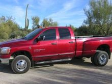 Dodge 3500 Big Horn Edition, Quad Cab dually, nerf bars, class 5 double hitch, electronic fuel modulator, 3 way power chip, Air Raid intake system, 4 inch exhaust, Pac Brake exhaust brake, 5000 lb Firestone airbags, bed liner and pad, Michelin tires.