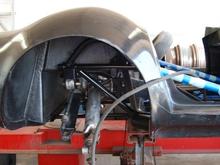 While waiting for the glue and resin to cure, we started putting the suspension and rear end into position.  Here, the differential and half shafts have just been installed.  the next step is the lateral links, trailing links and toe rods.