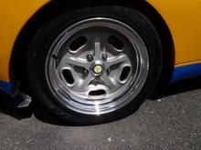 So, with the Lister badge now solidly epoxied in the new center caps, this is how they look in the wheel.  the bit of green in the center of the wheel definitely adds some nice detail.