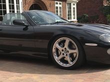 Mine was lowered using the Arden springs, UK agent at the time was Racing Green Cars who also fitted the Arden body kit etc. I don't know how much lowere than stock it is but I have no issues with the 20" wheels