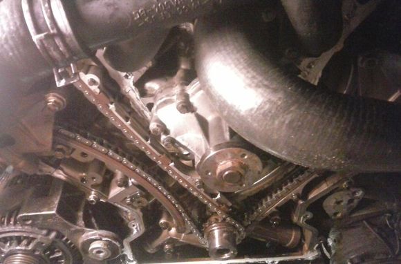are the top slipper guides upside down, does the slot go to the top? so the chain guard rain is against the timing chain cover?