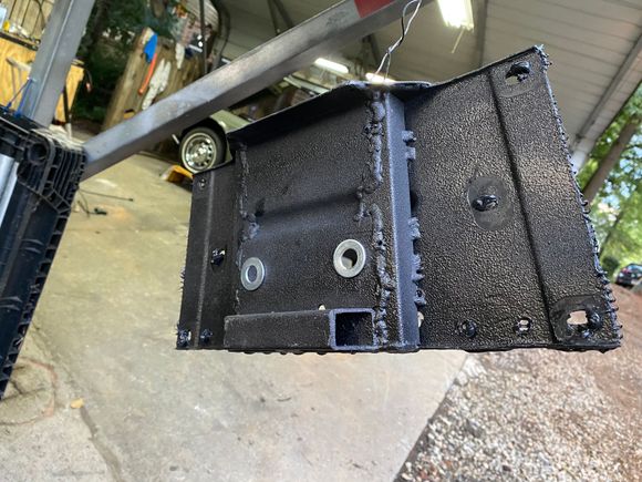 
2nd attempt Modifying the crossmember (view is of the bottom like if you were under car looking up).  You can see the outside of the crossmember now mounts flush against the body and the the center section where the transmission mount sits is stepped down 1” with the square tubing.  