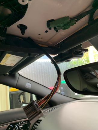 Put electrical tape on the bare roof metal to prevent any shorts to the garage remote board