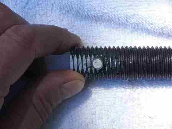 I filed a flat on the end of the rod so I could center punch for the cross hole. I drilled a 15/64" hole 1st then a 1/4" hole and had a nice tight slip fit.