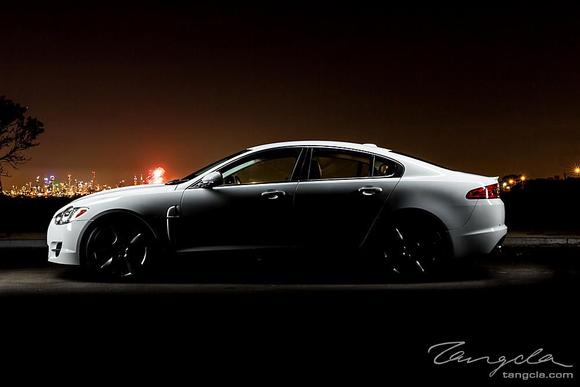 A silhouette composition, with fireworks in the background.