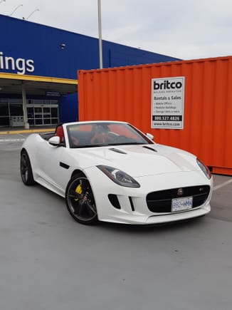 IKEA is blue and yellow. Big orange shipping container is orange. F Type is white on red, with ostentatious yellow brakes. Lots of colours. Nice car. Had to take a picture.