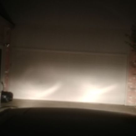 Both low beams only and you can see dark shadows on driver side.
