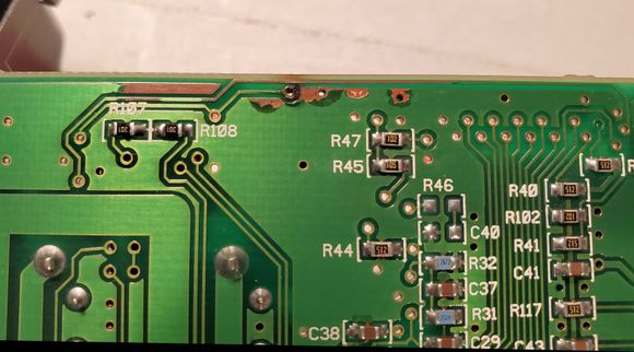 Damaged edge of circuit board after cleaning with alcohol.