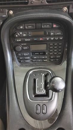 The XJ8 has broken interlock in transmission selector (not broken gearbox as advertised), often found after ignorant, ham-fisted wannabes wrench gear lever out of Park without first engaging footbrake.  I bought it with its fault preventing any stick selection other than R, N, D . . . the broken internal bits stopping the stick from engaging P or any transit over to manual side of J-Gate . . . nowt other than one position fore and aft of where you see the stick here, in 'N', which allows start. 