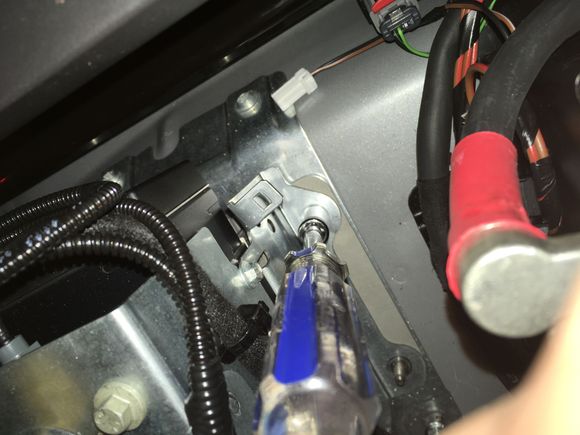 22. Then remove the nut closest to the battery terminal.  BE CAREFUL.
