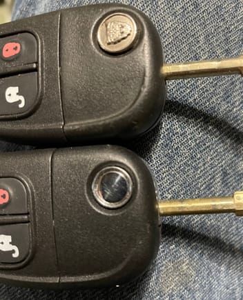 Original key on top.  New key thats hardly worn on the bottom