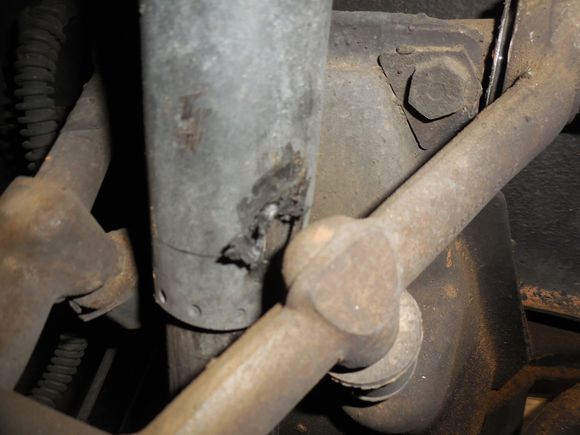 Rubbed a hole in outer shock housing.