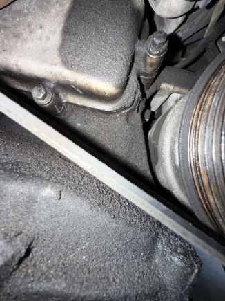 Oil seeping past upper-right bolt.