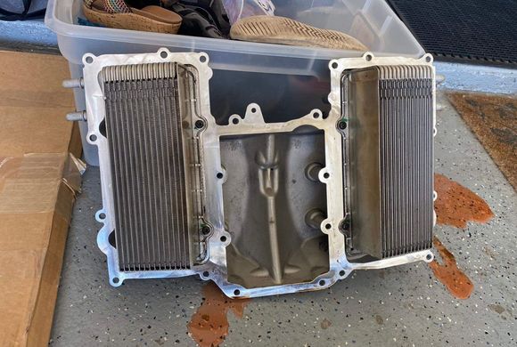 This is the V6….There are 4 torx bolts each intercooler holding it to the cover. Probably a gasket too where the water feeds poke through the cover each side.
However masking up as you planned should work. 