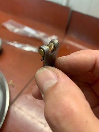 Bent the steel strap over brass rod for shape. 
 Then cut the slot.Brass rod cut to length, drilled and tapped.  