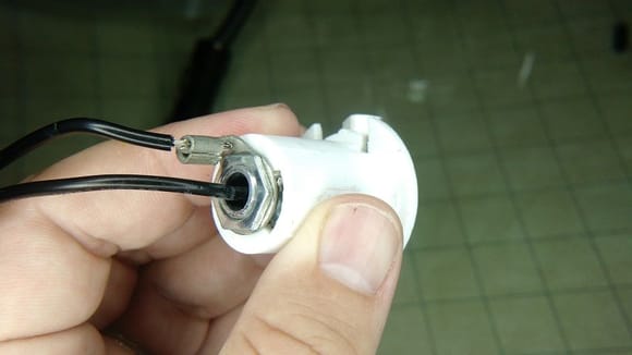 Plastic housing modified to seat candelabra socket.