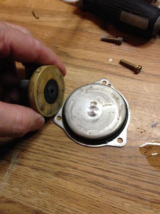backside of impeller in my hand and separation plate with worn surface.