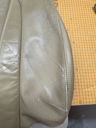 WEAR ON OUTER MOST DRIVER PANEL SEAT BACK