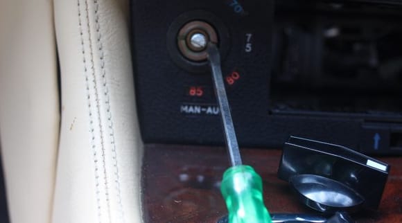 Undoing the Lock Nuts on the Air Con Controls with a Screw Driver, no need for Special Tools.
