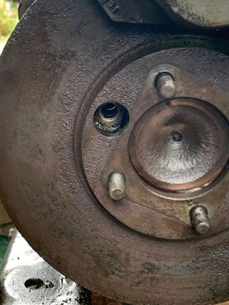Hole gives access to bolts.