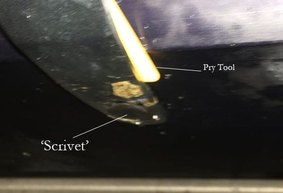 Trying to illustrate location of the 'scrivet' holding the splitter in place