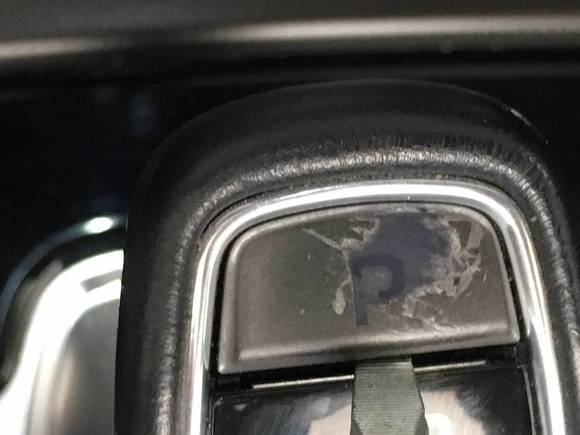 Note the small screwdriver blade inserted at the bottom edge.