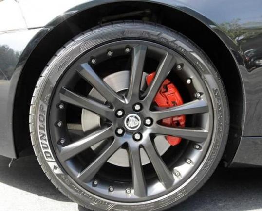 Satin black wheels red calipers