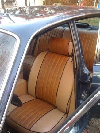 the new seats, burl wood grain inserts and black piping since most of the car is trimmed out in black