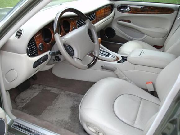1999 XJ8 Vanden Plas; mint condition oatmeal leather with lambswool carpet in like-new condition.