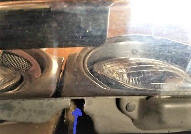 Cut notch in plastic for hinge arm