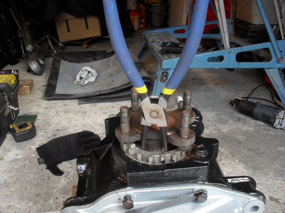 A decent pair of circlip pliers are required to release the circlip.