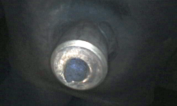 Snapped-off heat shield bolt, methinks....