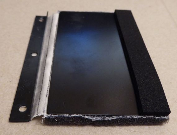 Restored flap, new cloth, foam strip along bottom to stop opening noise, foam on inside side to stop closing noise.