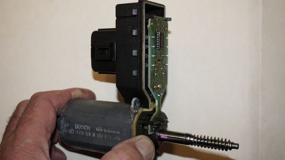 So I assembled those parts above again and holding them together I connected them to the connector on the car and tried the window UP and DOWN button (with ign. on). The motor moved each time. 