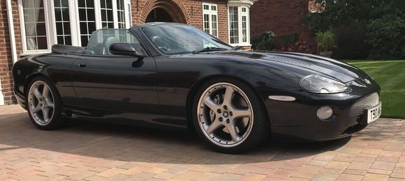 Mine was lowered using the Arden springs, UK agent at the time was Racing Green Cars who also fitted the Arden body kit etc. I don't know how much lowere than stock it is but I have no issues with the 20" wheels