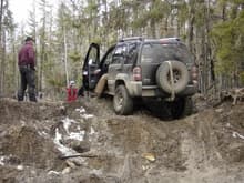 hungup on the skids, front wheels grabbing nothing but air.  the trail is along the Martineau River north of Cold Lake.