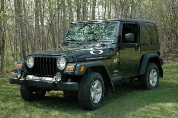 My Bone Stock 2005 Jeep TJ not the day I bought it but soon after that day after I got the head to toe mud off of it :0)