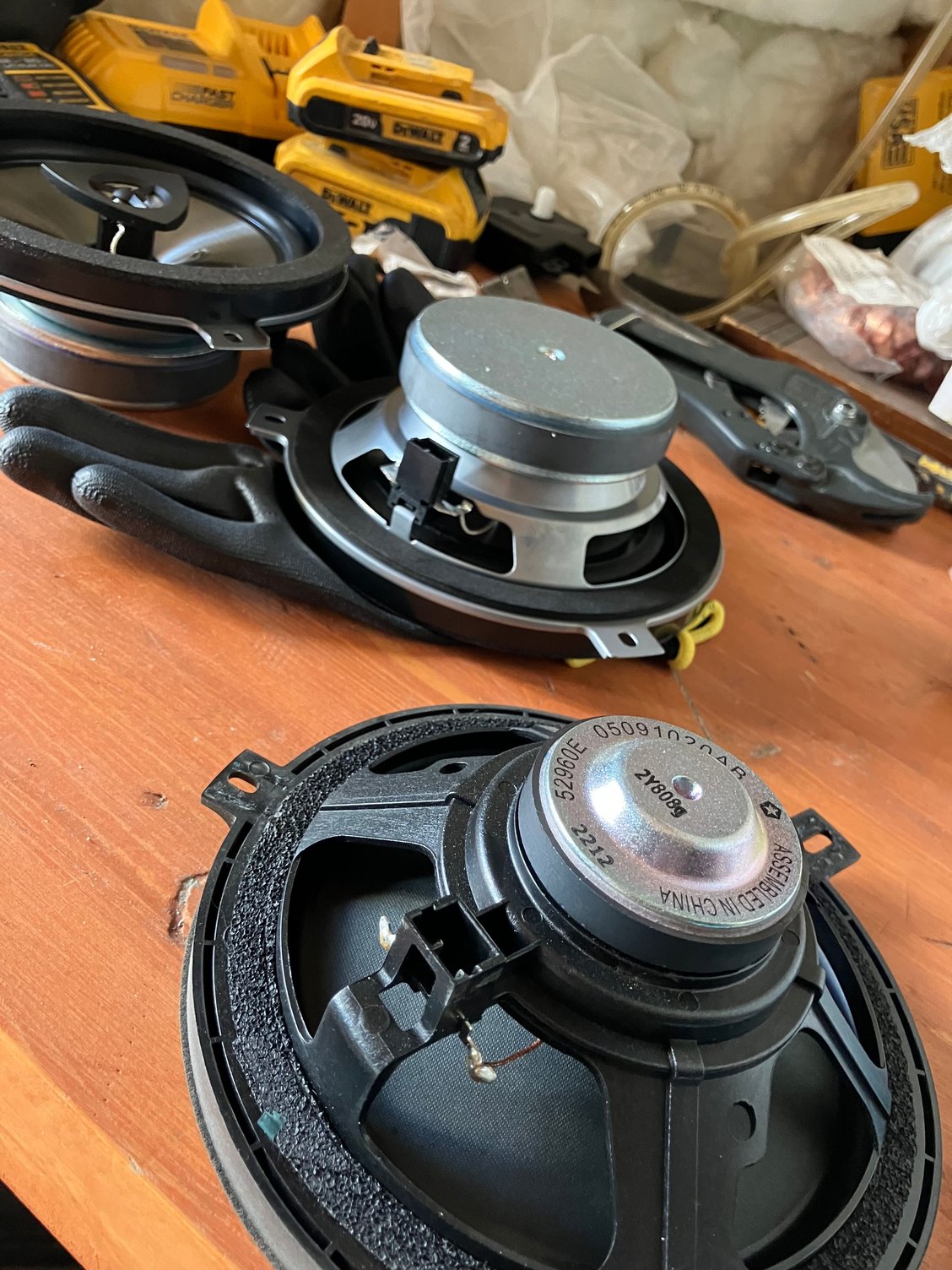 Stock speaker in foreground, 77KICK10s in background.  Huge magnet difference!