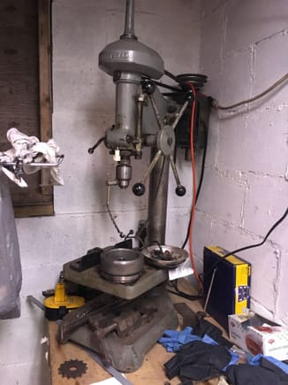 The drill press seemed like a good place to store the stator. Giant magnet meet cast iron table.